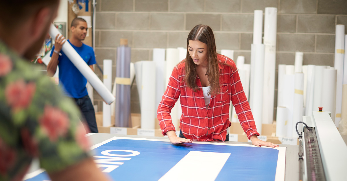 School using wide format printer for banner
