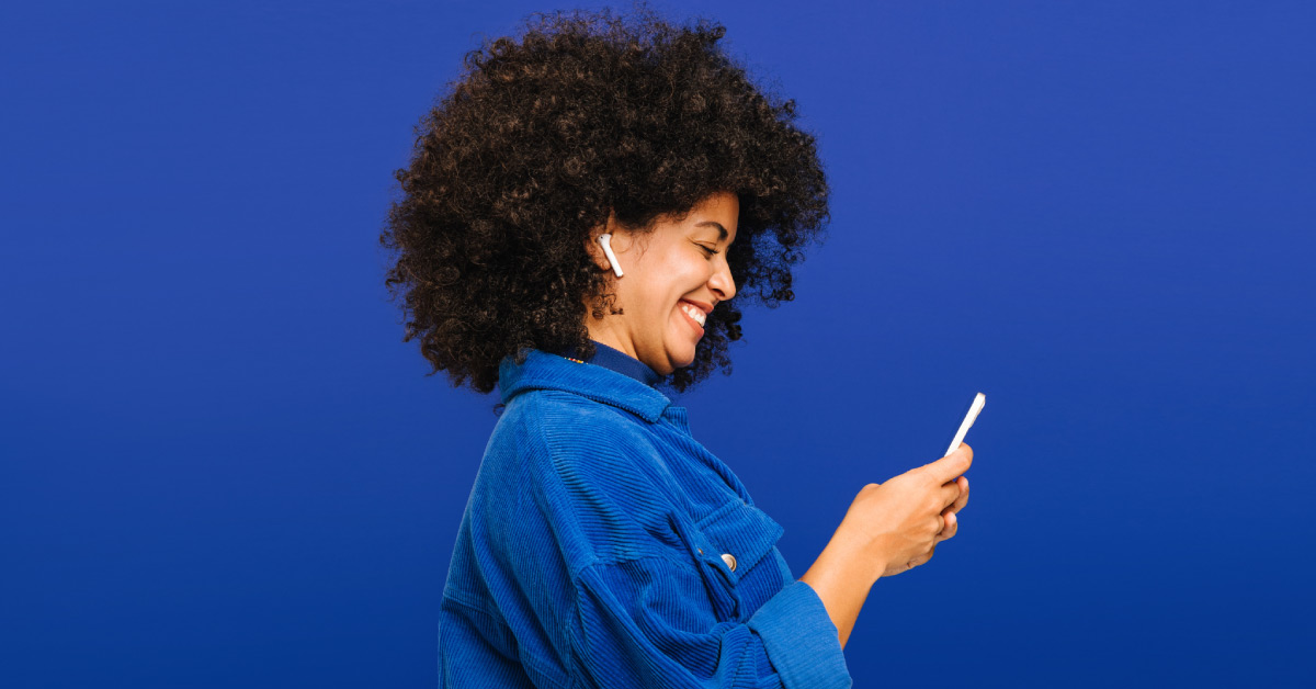 Woman smiling at phone