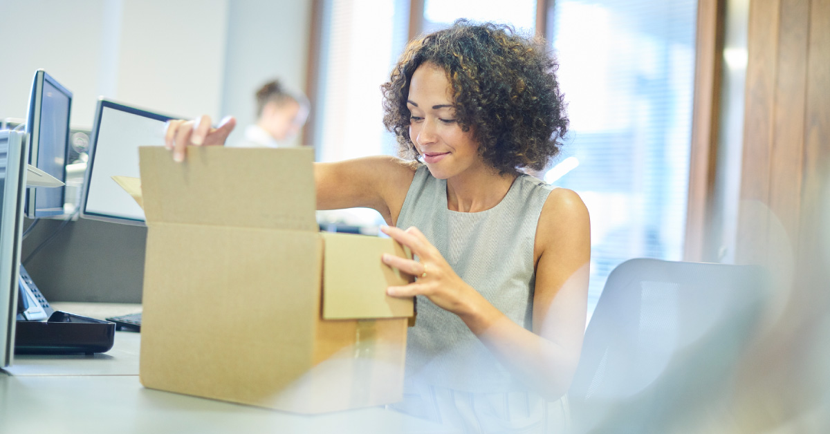 Woman opening new phone systems box