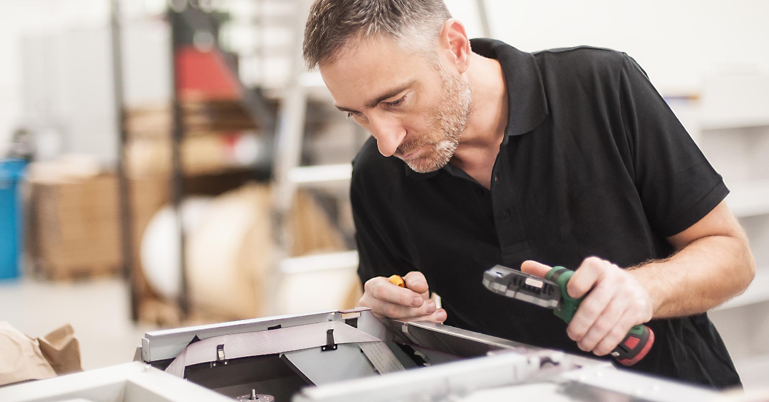 Man inspecting printer
