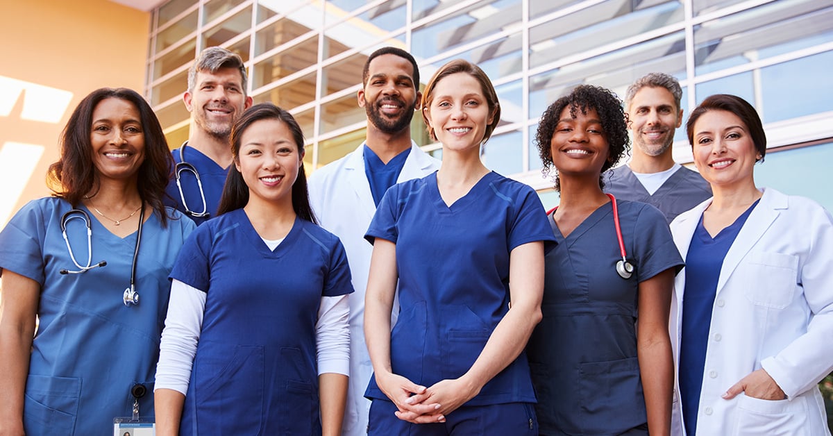 Smiling group of doctors and nurses.
