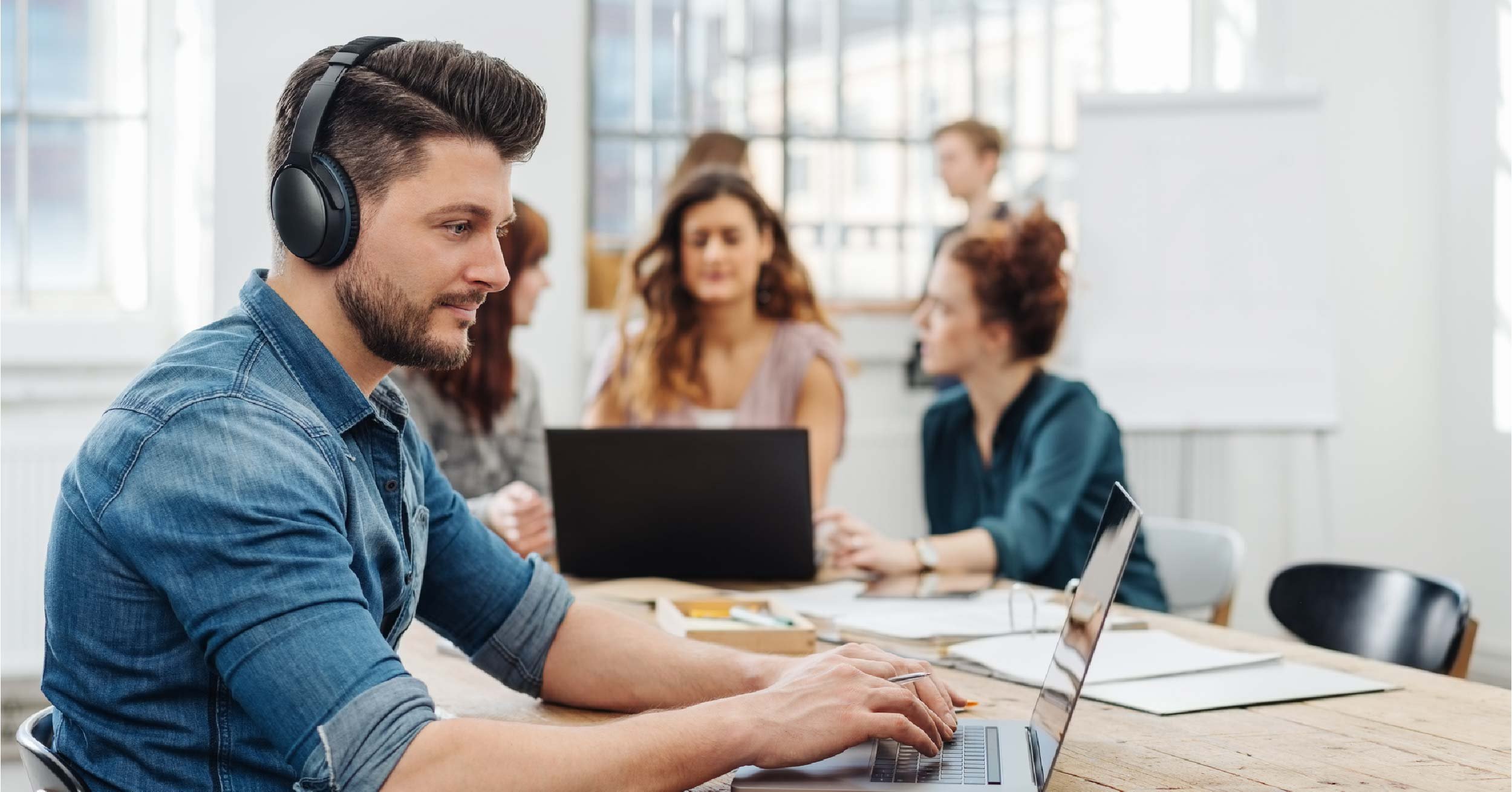 Man wearing noise cancelling headphones