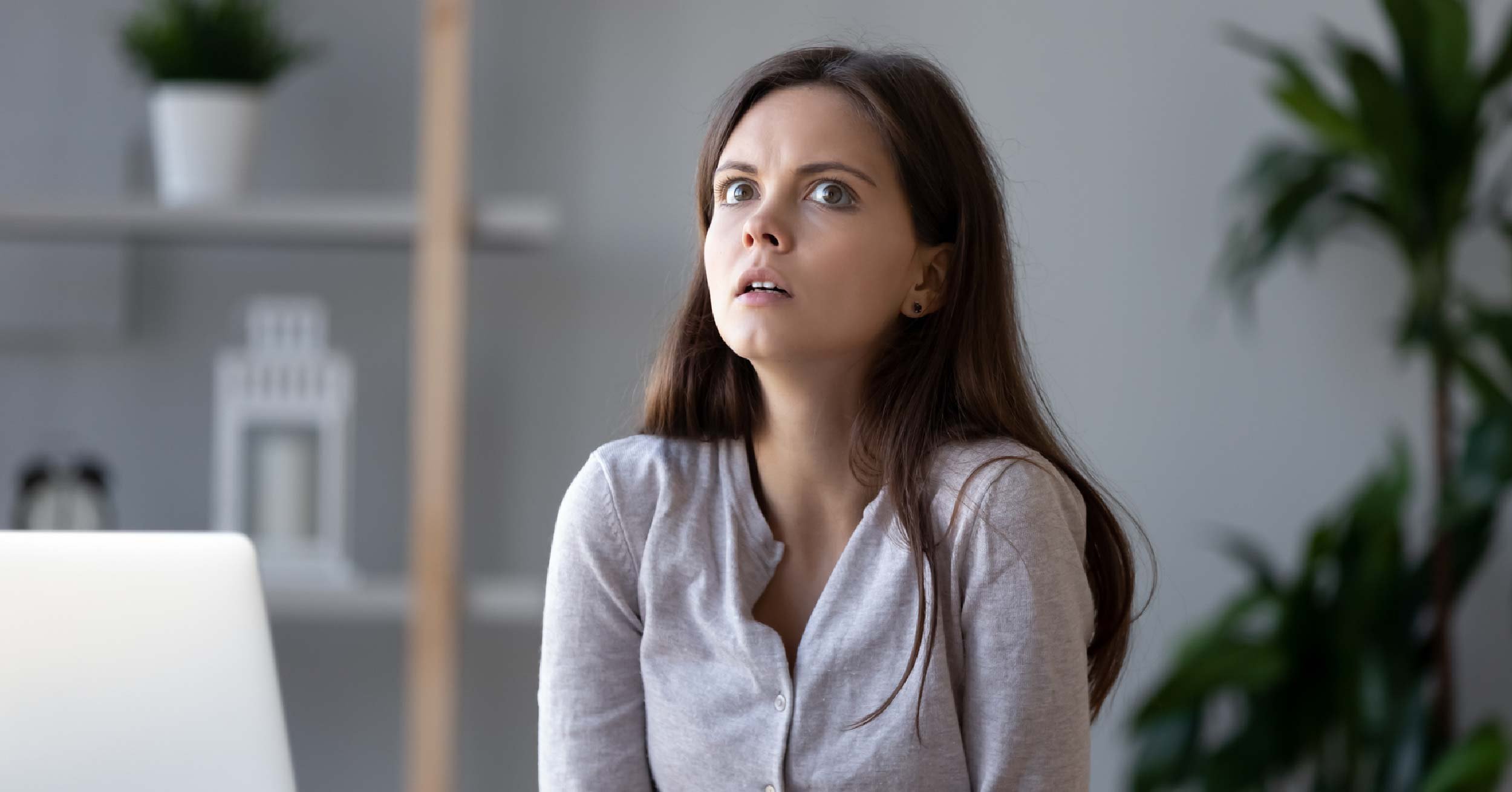 Woman overhearing something at work