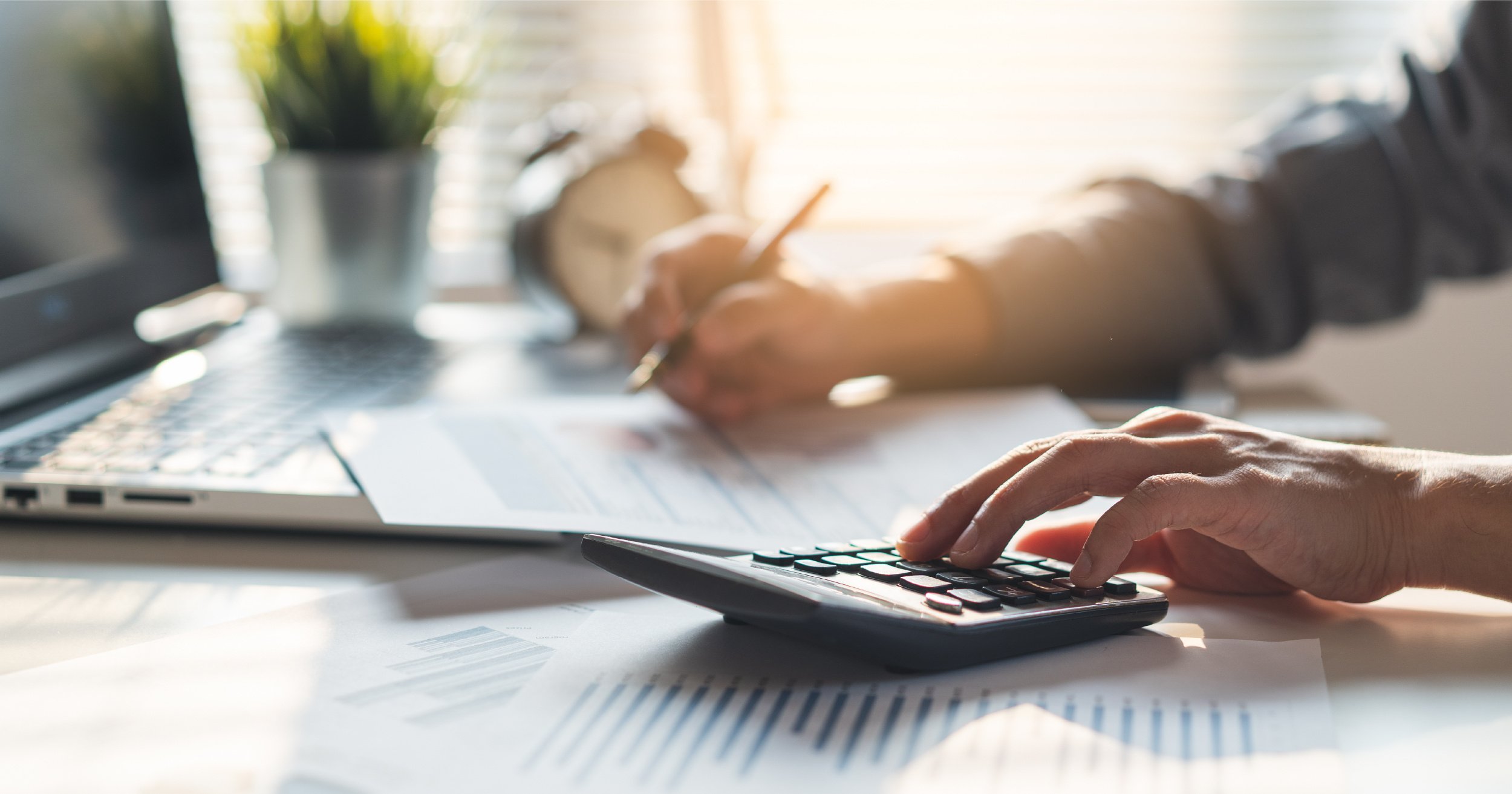 Executive calculating Microsoft costs.