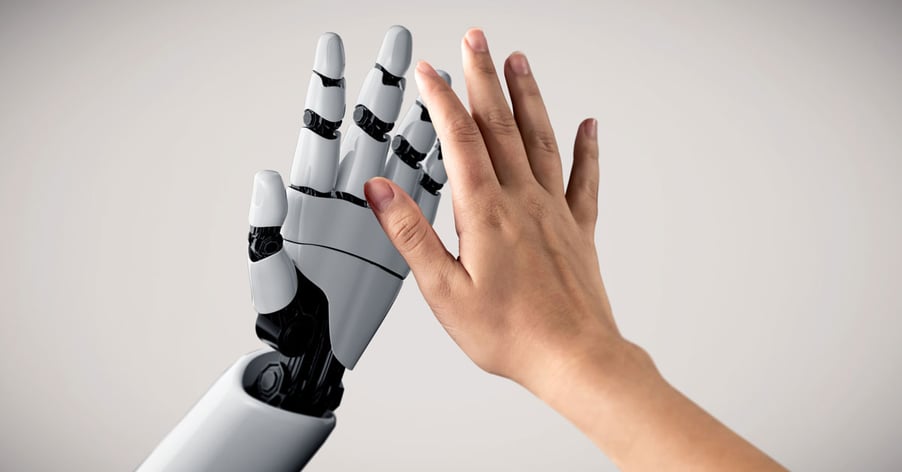 AI robot and human touching hands.