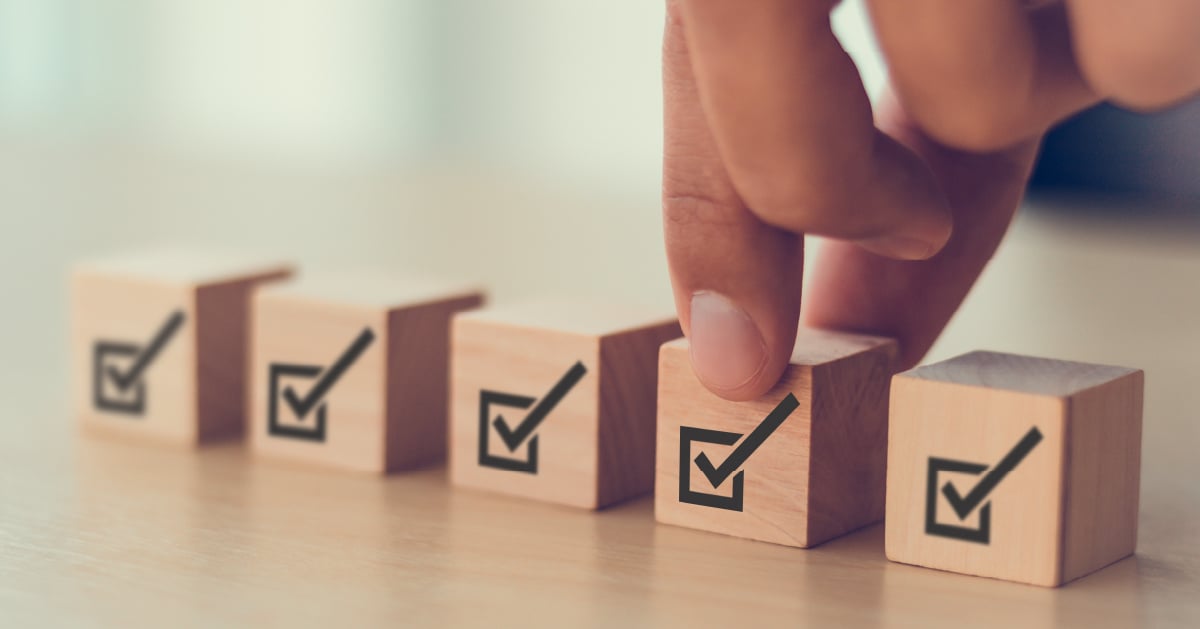 Person placing check boxes for business security