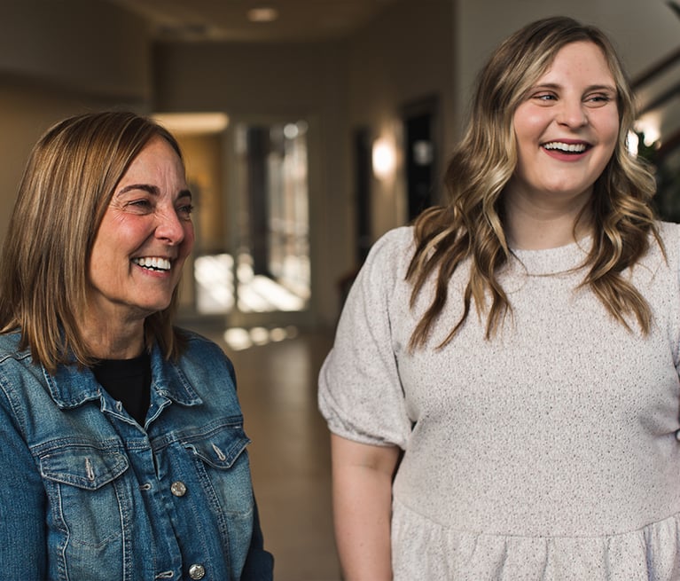 Two smiling individuals