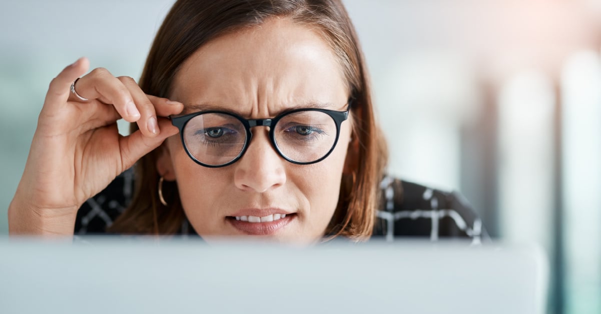 Confused employee looking at computer