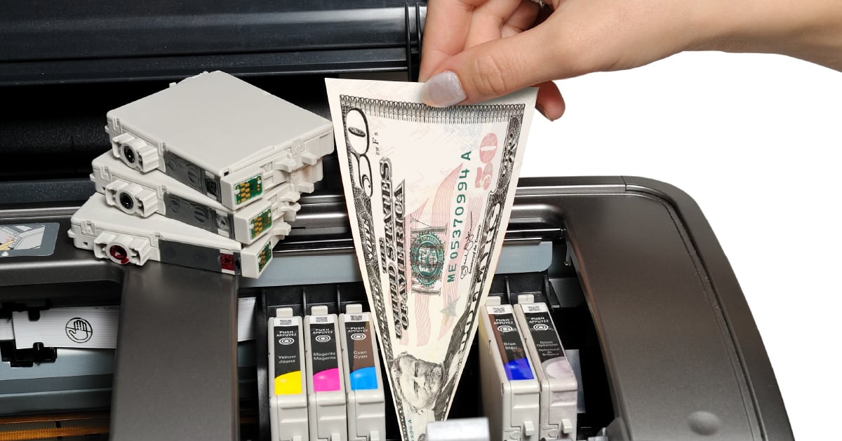 A woman feeds a US dollar into her printer next to a variety of colored ink cartridges to demonstrate how outdated devices cost businesses money.