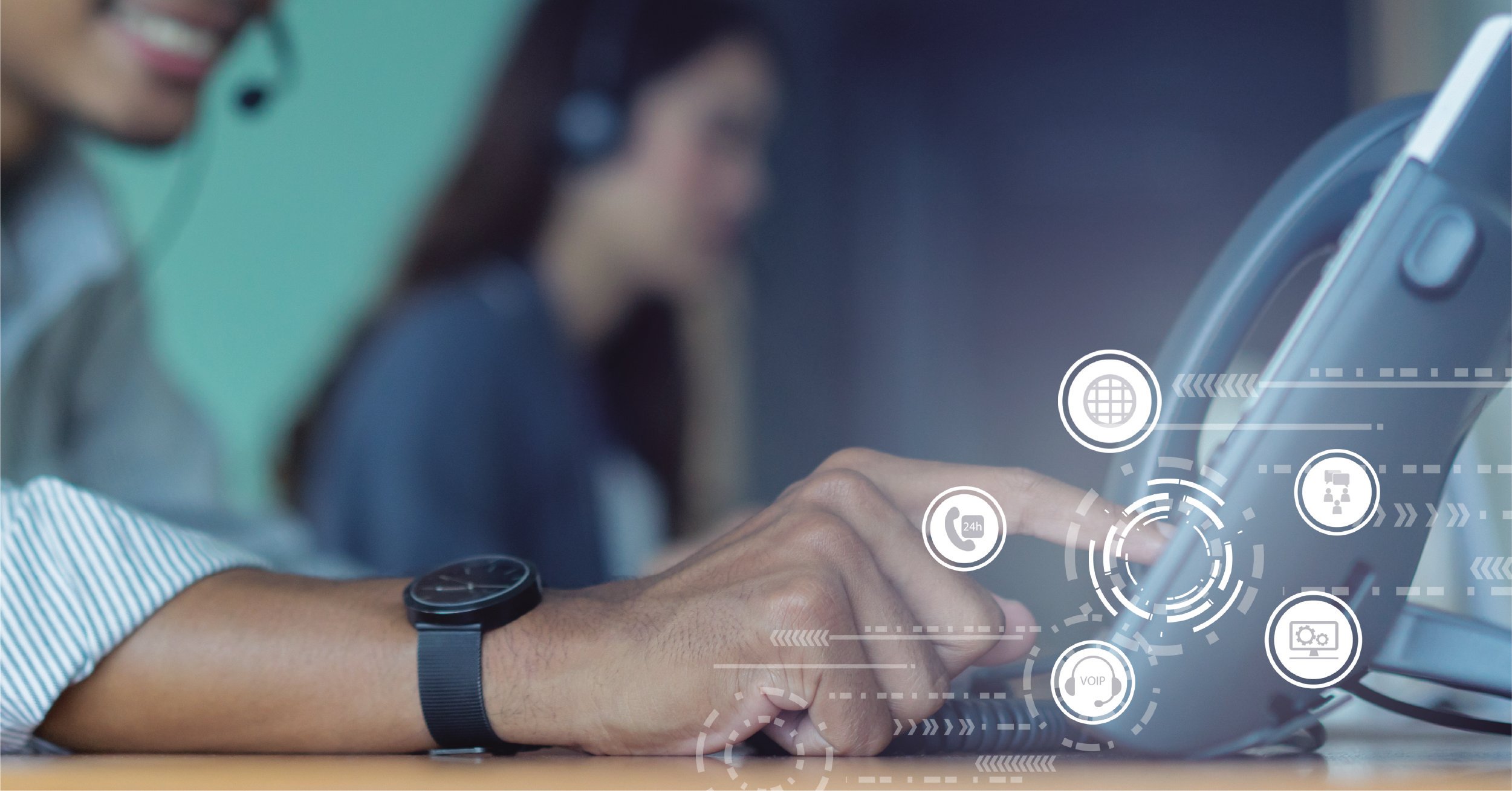 A male employee uses a modern business phone system with multiple features highlighted in icons. 