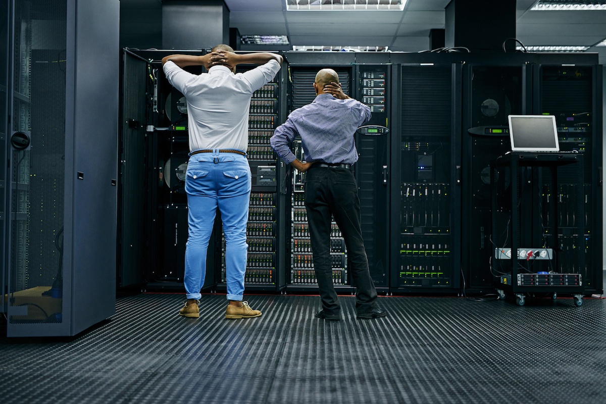 employees standing in front of server bank