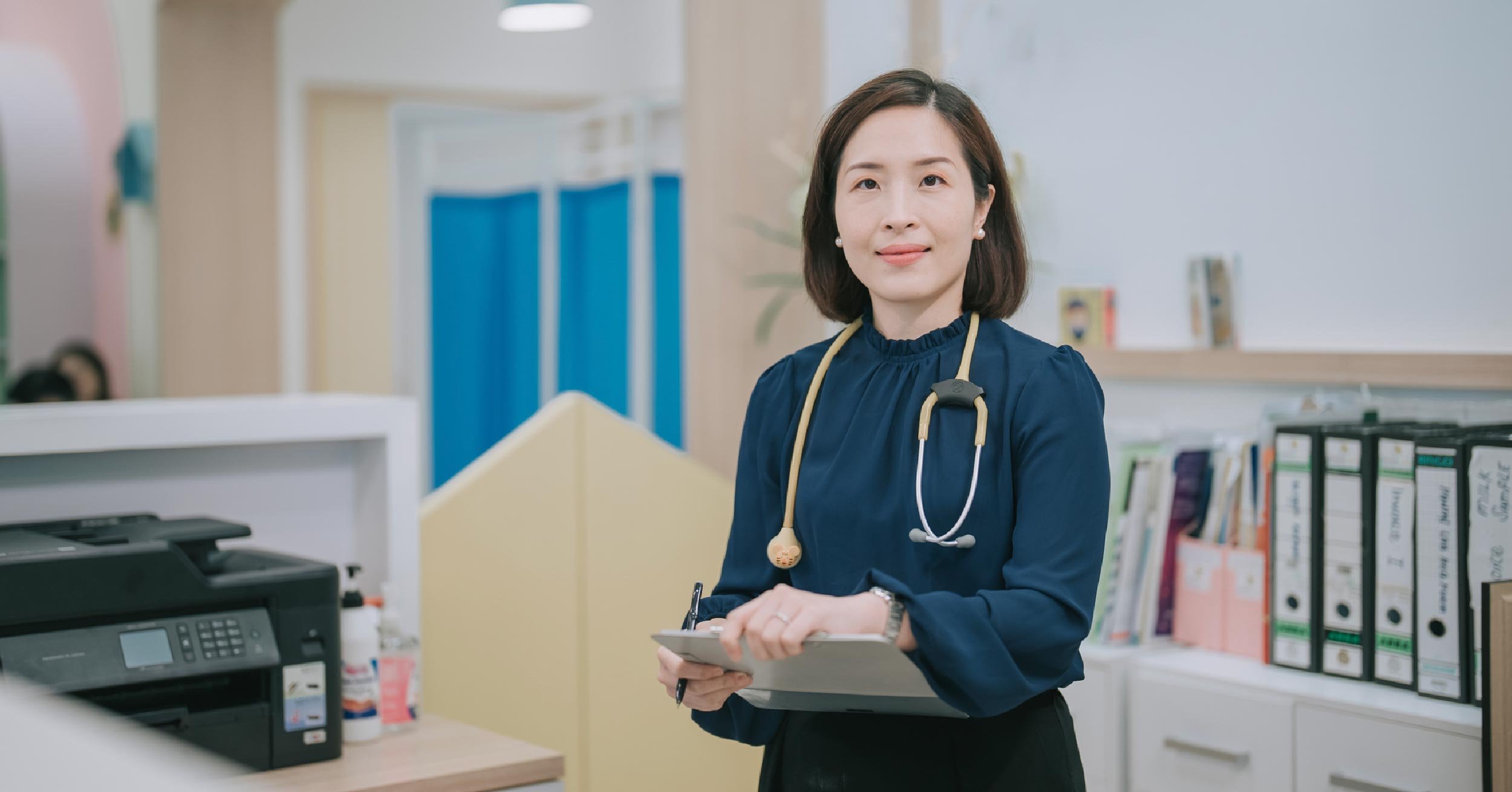 healthcare worker with printer