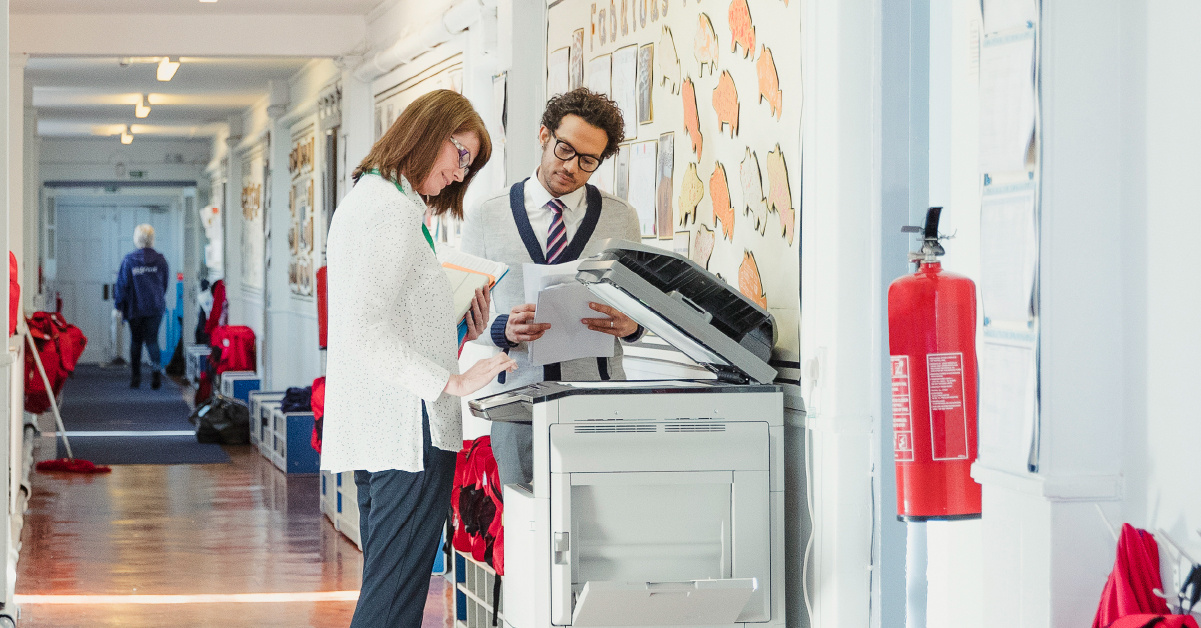 School employees using PaperCut software to save time.