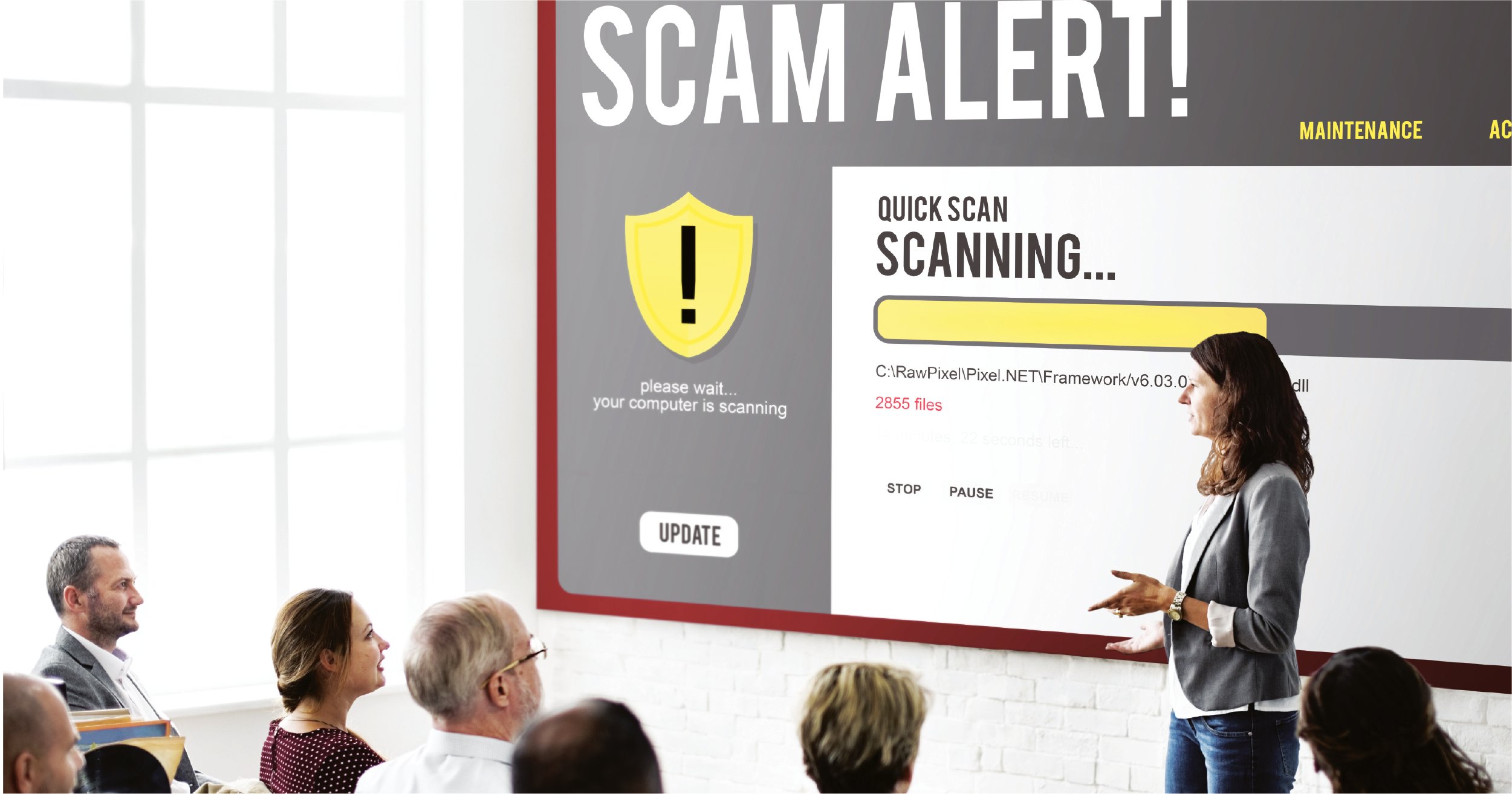 Employees being shown scam alert memo during security training.