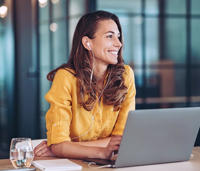 Woman on laptop smiling