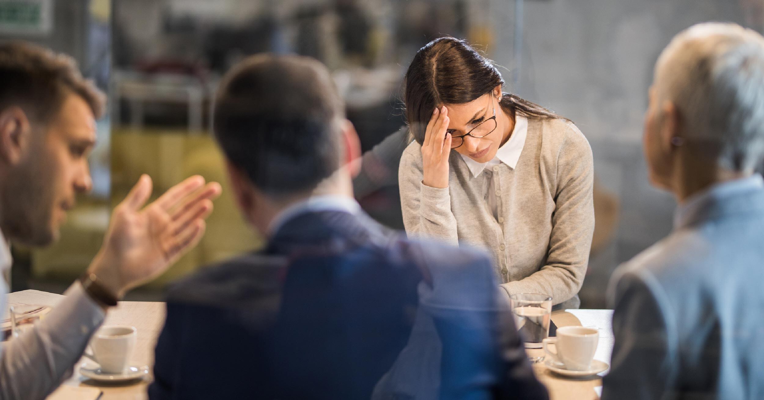 Coworker struggles to hide their frustration as change fatigue sets in over the implementation of new cloud solutions.